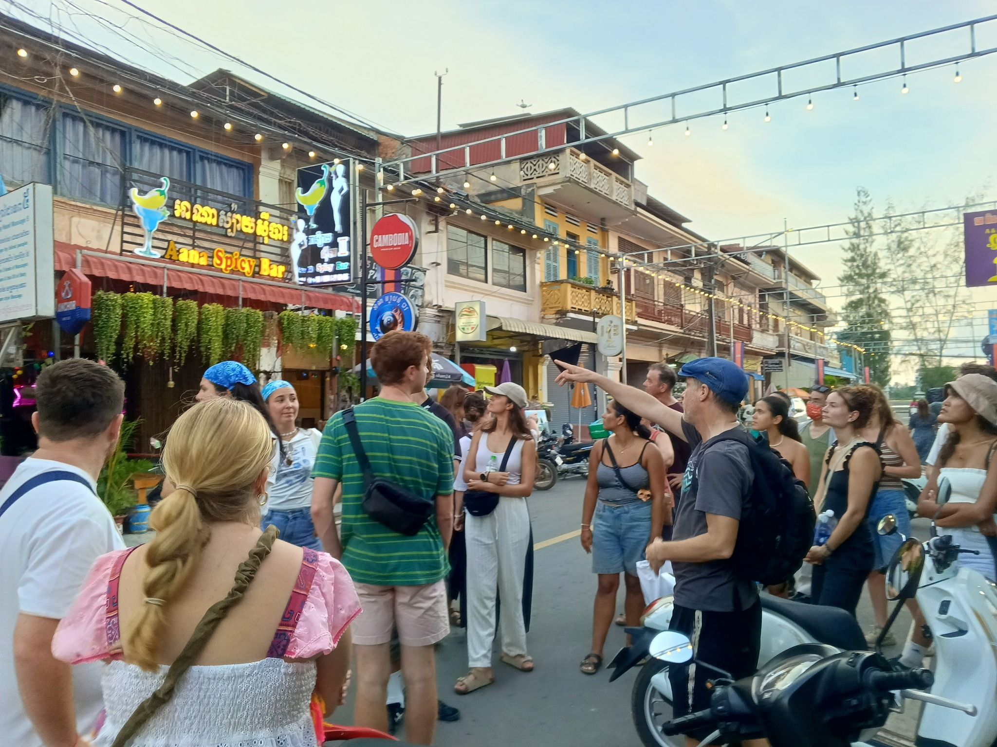Travellers meeting outside Monkey Republic Hostel in Kampot before the walking tour